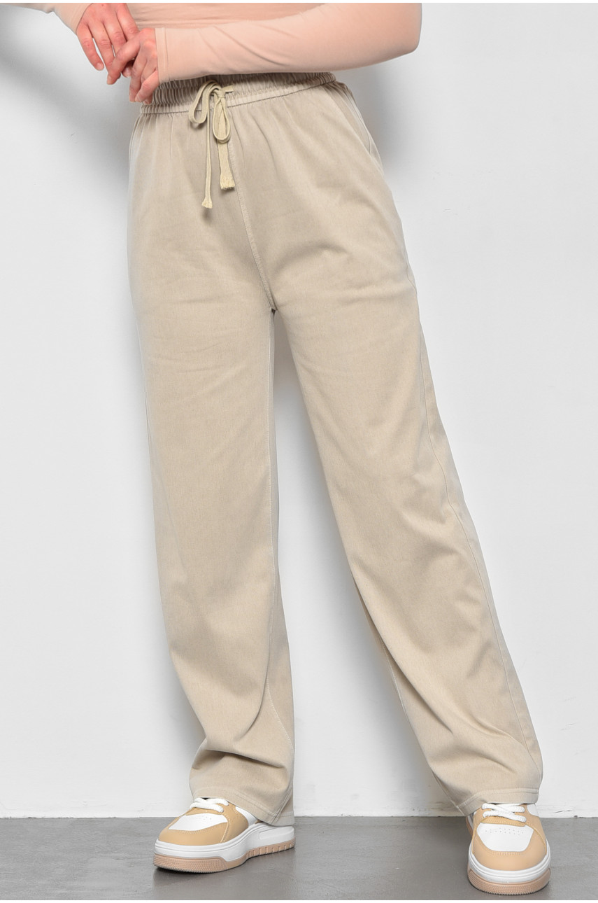 Штани жіночі розкльошені напівбатальні бежевого кольору 560-2 173437