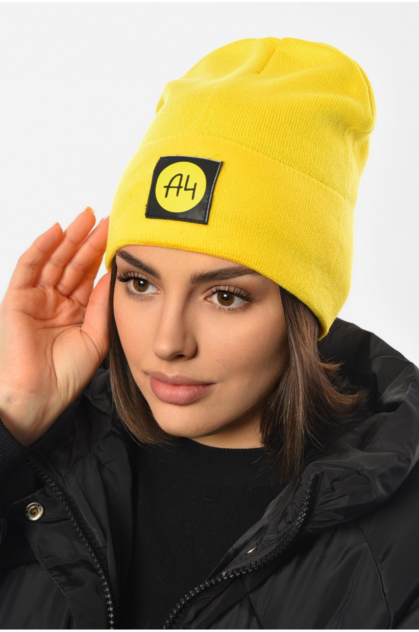 Шапка жіноча зимова на флісі однотонна жовтого кольору 193192