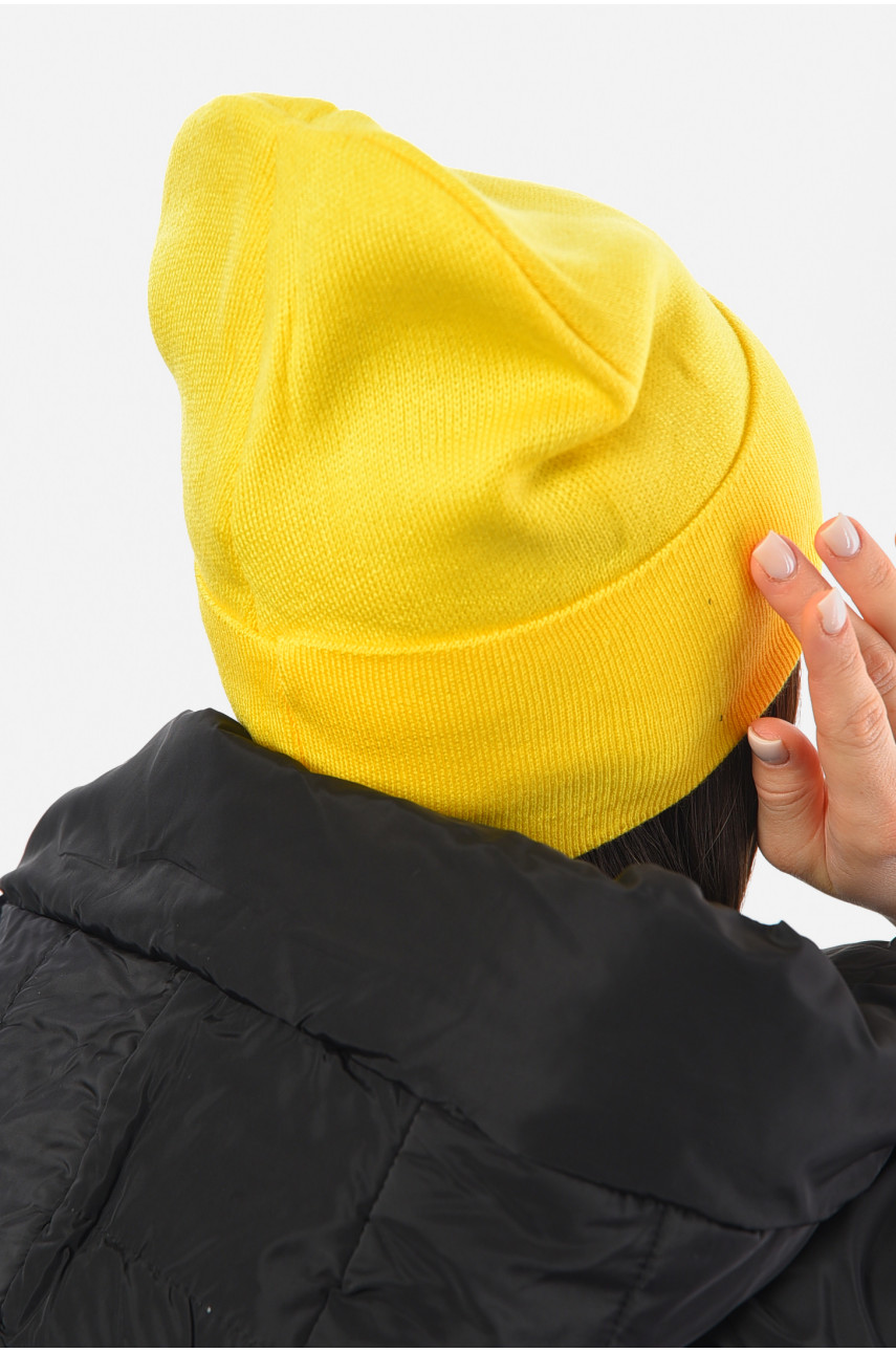 Шапка жіноча зимова на флісі однотонна жовтого кольору 193192