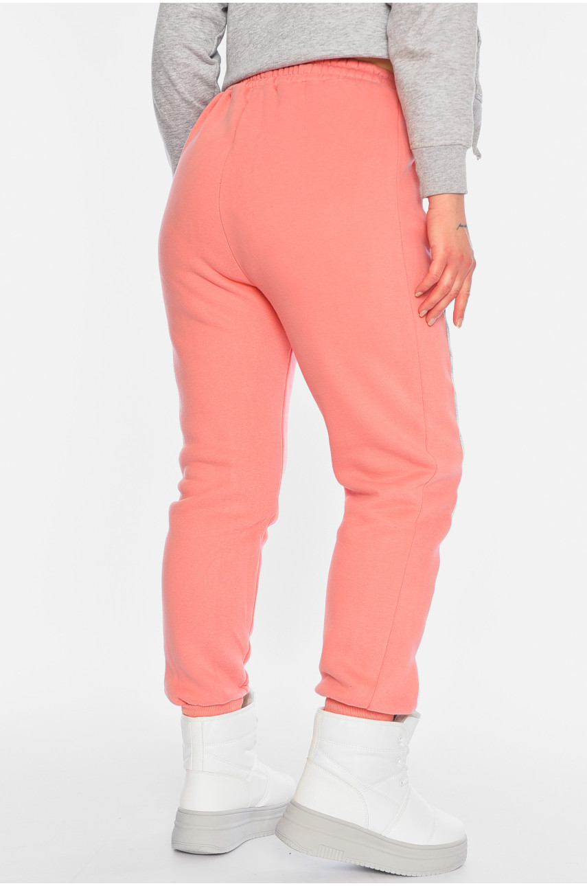 Спортивні штани жіночі на флісі персикового кольору 21334 196369