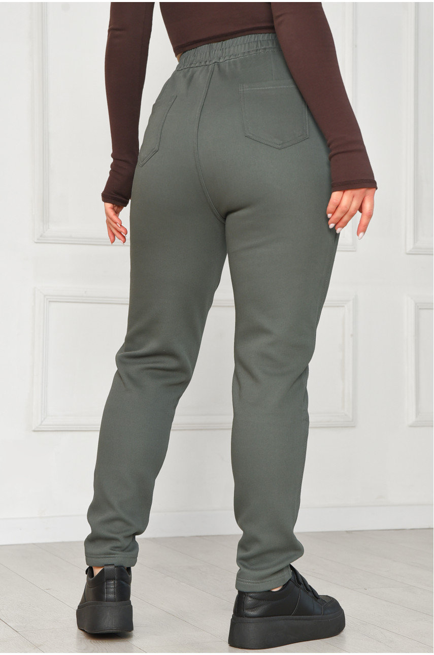 Штани жіночі однотонні на флісі зеленого кольору А4075-2 209570 Штани жіночі однотонні на флісі зеленого кольору А4075-2 209570