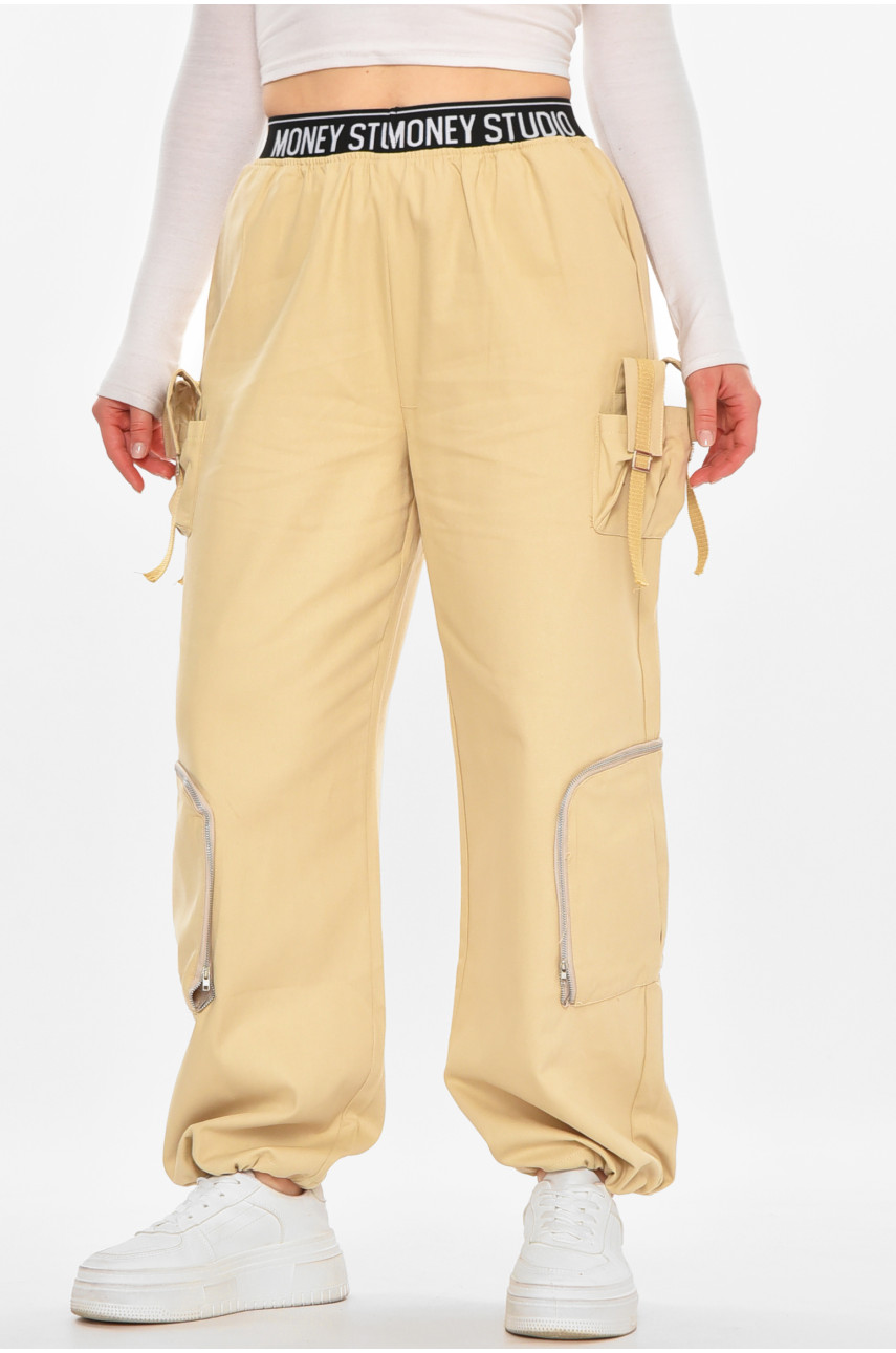 Штани жіночі однотонні бежевого кольору 832-1 212401