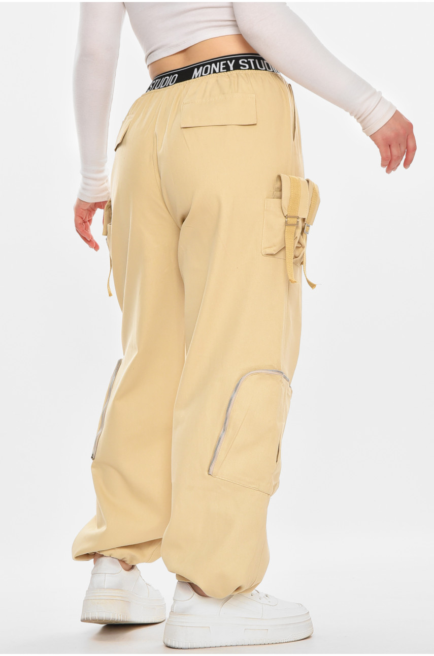 Штани жіночі однотонні бежевого кольору 832-1 212401