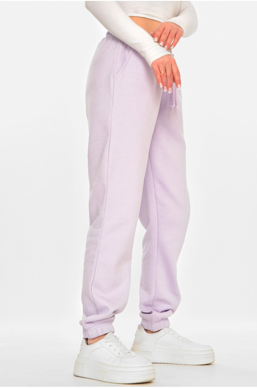 Спортивні штани жіночі на флісі бузкового кольору 212635