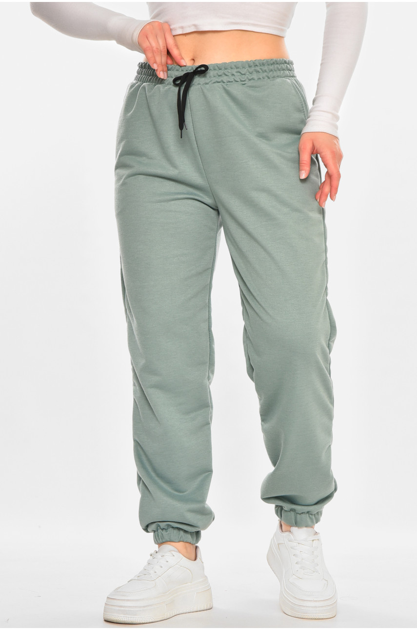 Спортивні штани жіночі напівбатальні однотонні зеленого кольору 212817