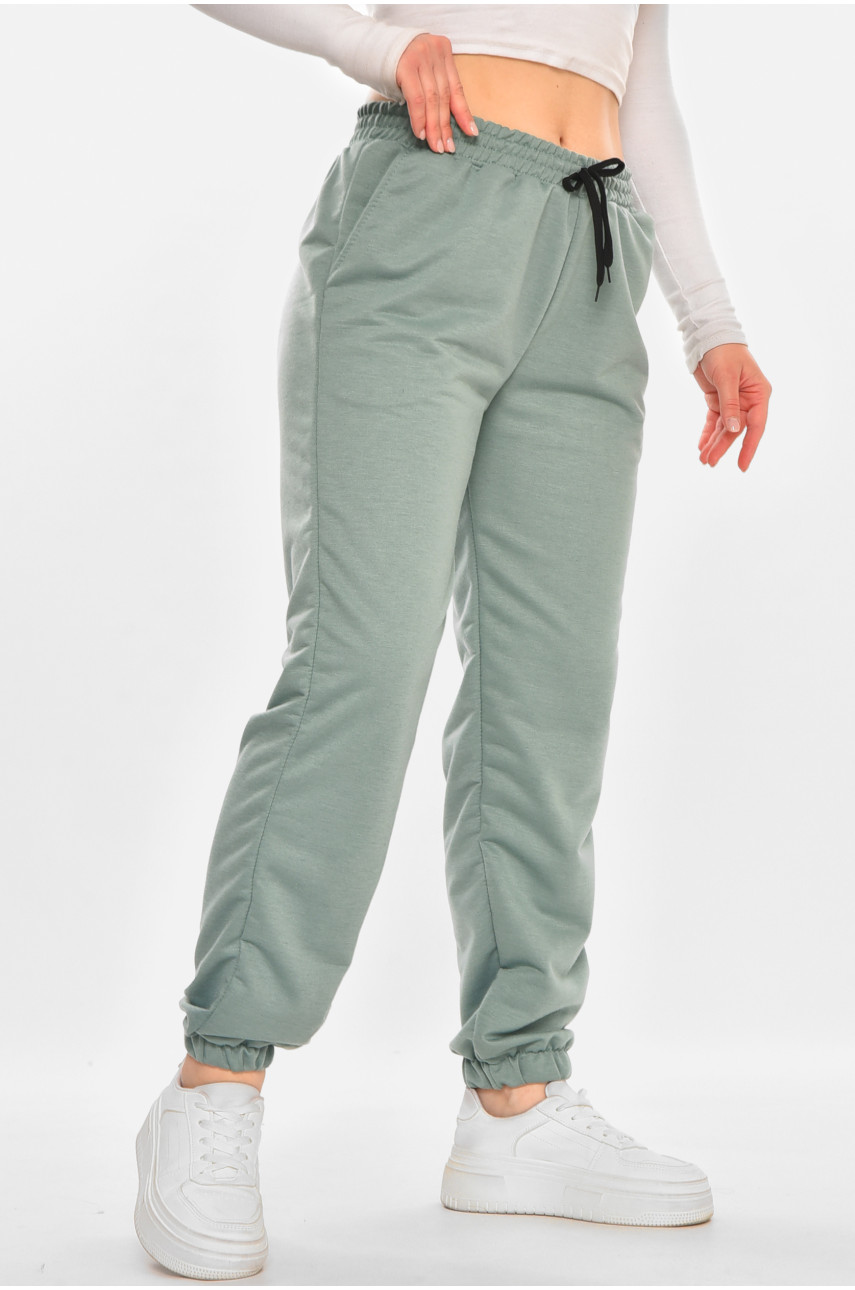 Спортивні штани жіночі напівбатальні однотонні зеленого кольору 212817