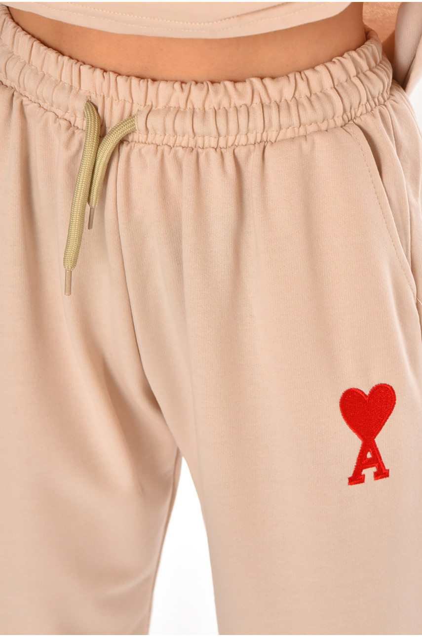 Спортивный костюм женский бежевого цвета 212948